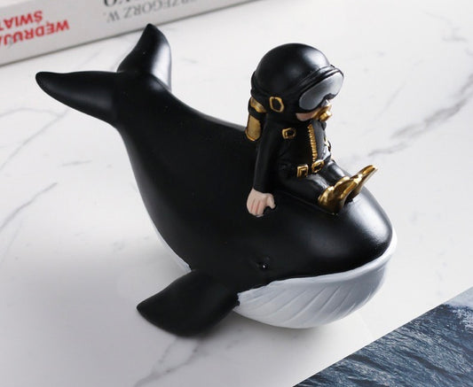 Statuette of a diver on a whale