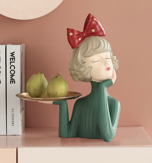 Decorative figurine girl with a tray