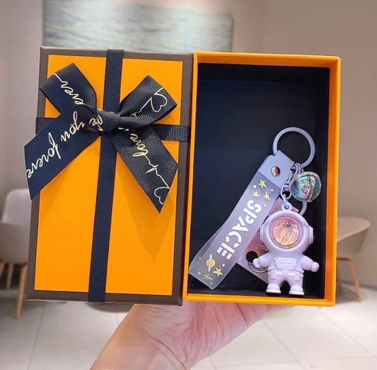 Astronaut keychain with flashlight purple