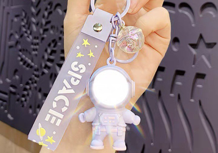 Astronaut keychain with flashlight purple