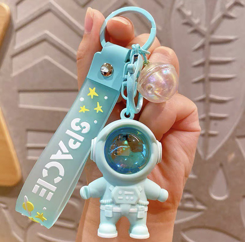 Astronaut keychain with flashlight green