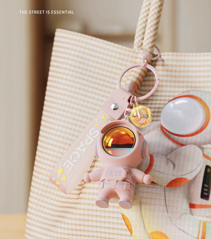 Astronaut keychain with flashlight pink
