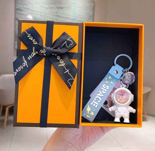 Astronaut keychain with flashlight blue