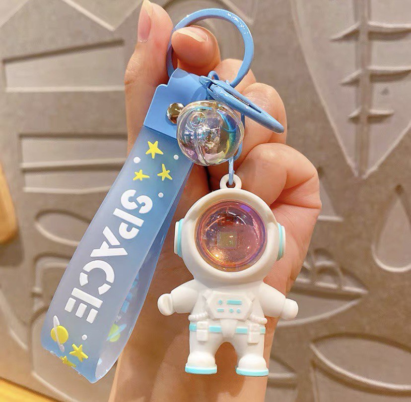 Astronaut keychain with flashlight blue
