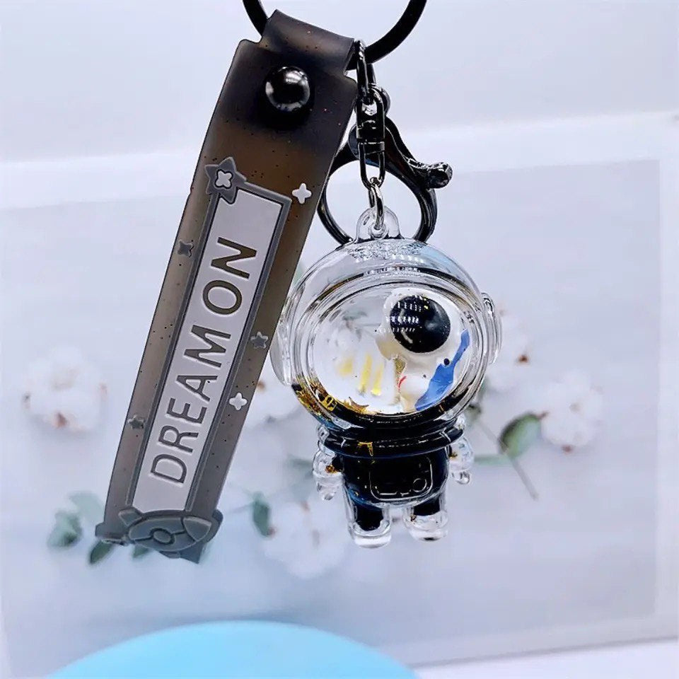 Keychain astronaut with guitar