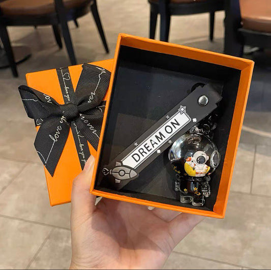 Keychain astronaut on a moon