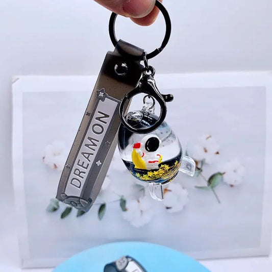 Keychain astronaut in a rocket on moon