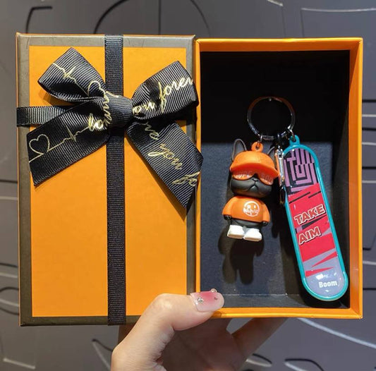 Keychain dog with skateboard orange