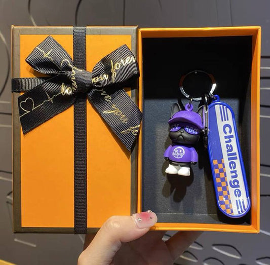 Keychain dog with skateboard purple