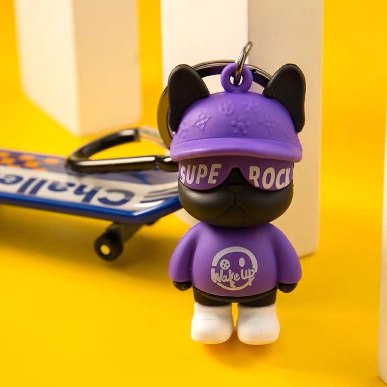 Keychain dog with skateboard purple