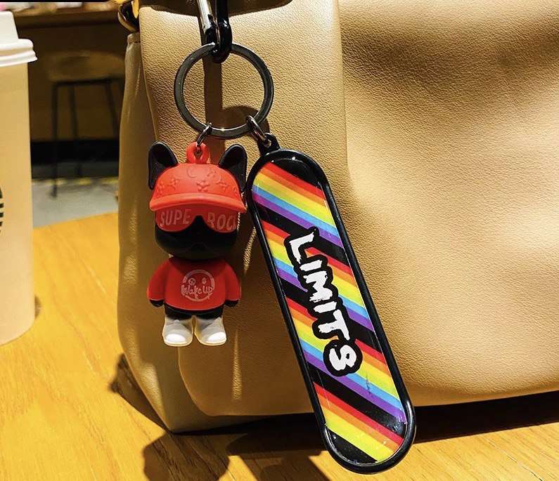 Keychain dog with skateboard red