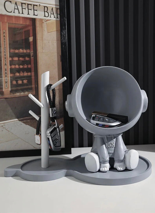 Astronaut figurine with a stand for small items, gray