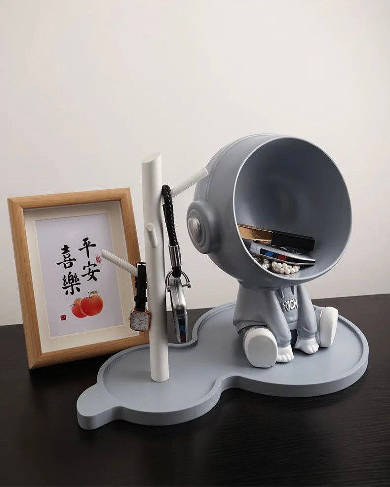 Astronaut figurine with a stand for small items, gray