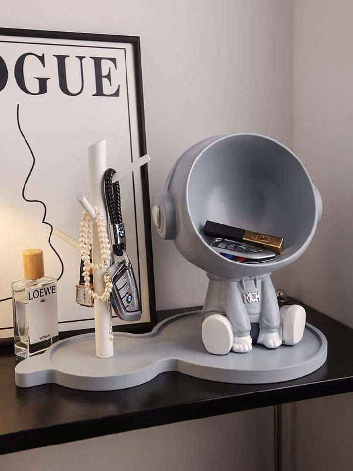 Astronaut figurine with a stand for small items, gray