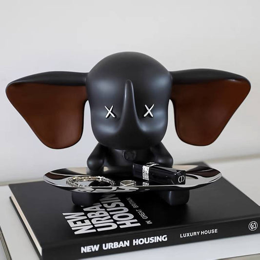 Black elephant figurine with tray