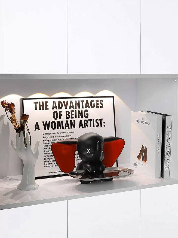 Black elephant figurine with tray