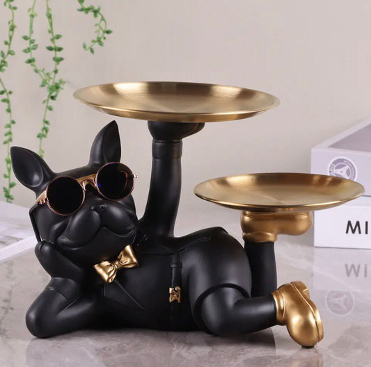 Figurine of a dog wearing sunglasses with two trays in golden shoes
