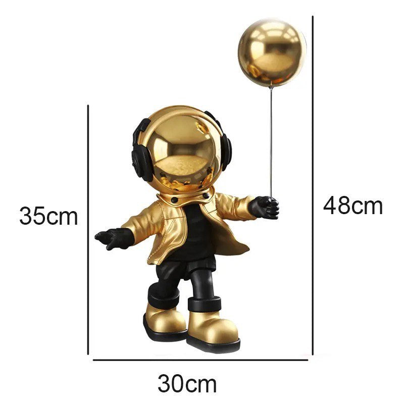 Blue astronaut figurine with ball
