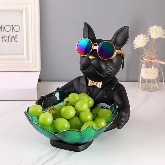 Dog figurine in sunglasses with a fruit plate