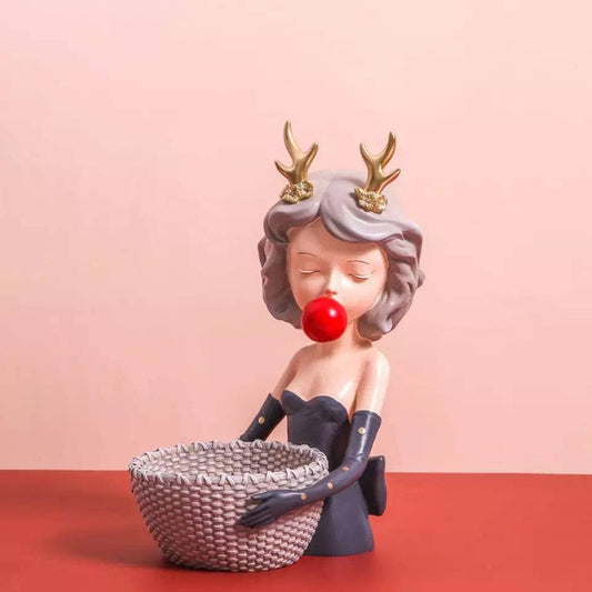 Figurine girl with a basket