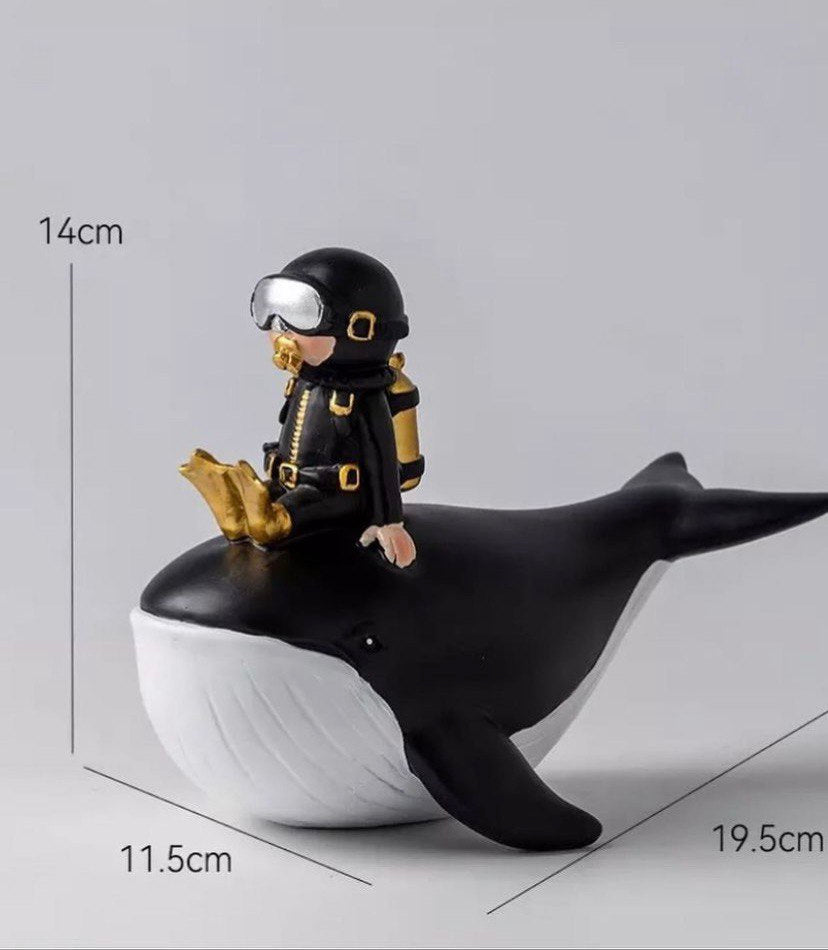 Statuette of a diver on a whale