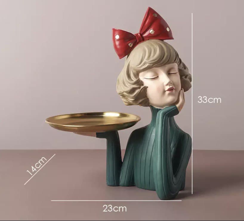 Decorative figurine girl with a tray