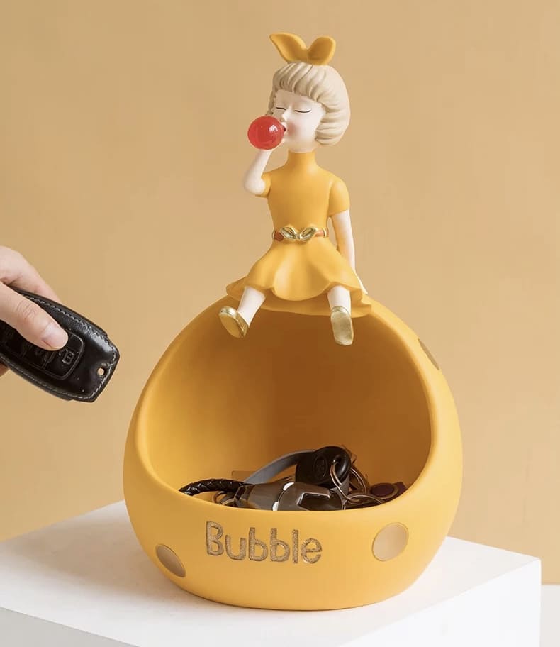 Figurine, phone stand girl with gum orange