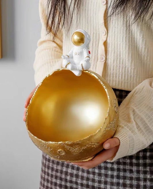 Figurine, candy container astronaut on the moon meditating