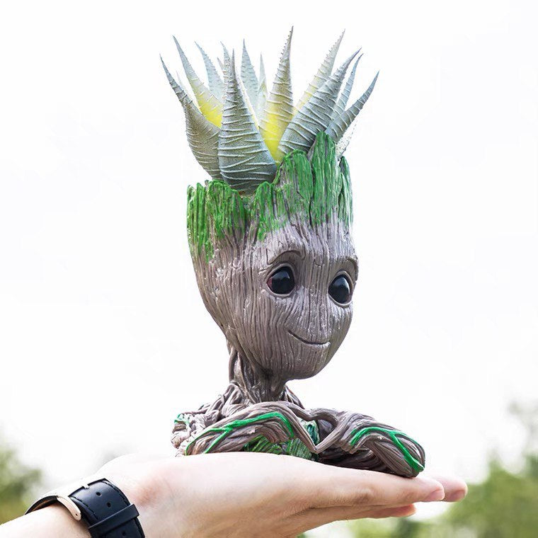 Vase, plant pot, plant heart in hands