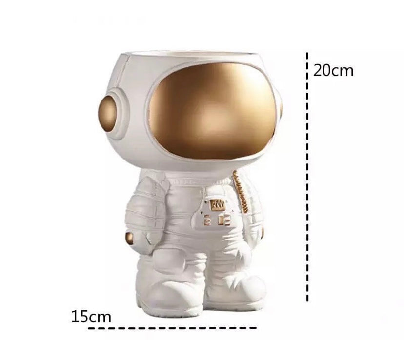 Astronaut figurine, plant pot