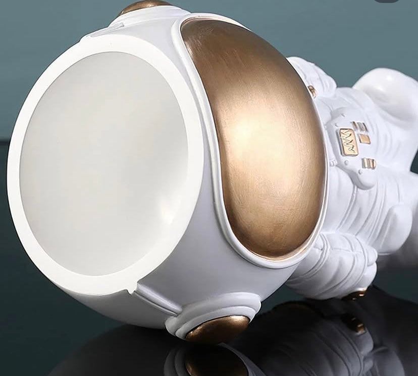 Astronaut figurine, plant pot