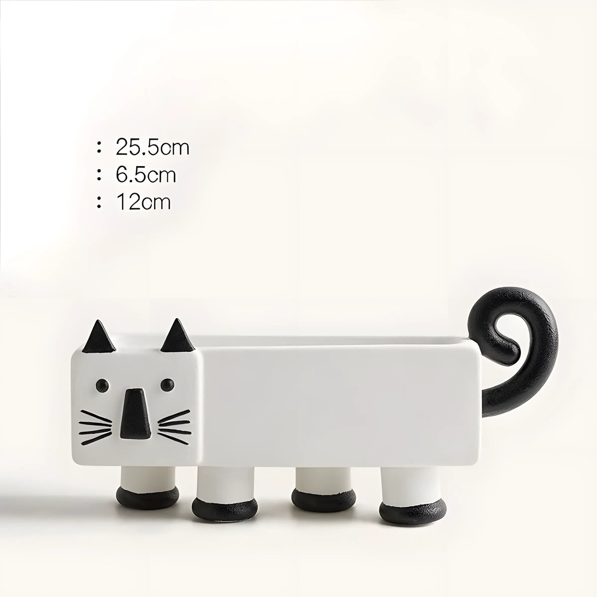 A white cat-shaped planter with black accents, including pointed ears, facial features, whiskers, and a curled tail, shown on a plain light background with height measurements listed on the left.