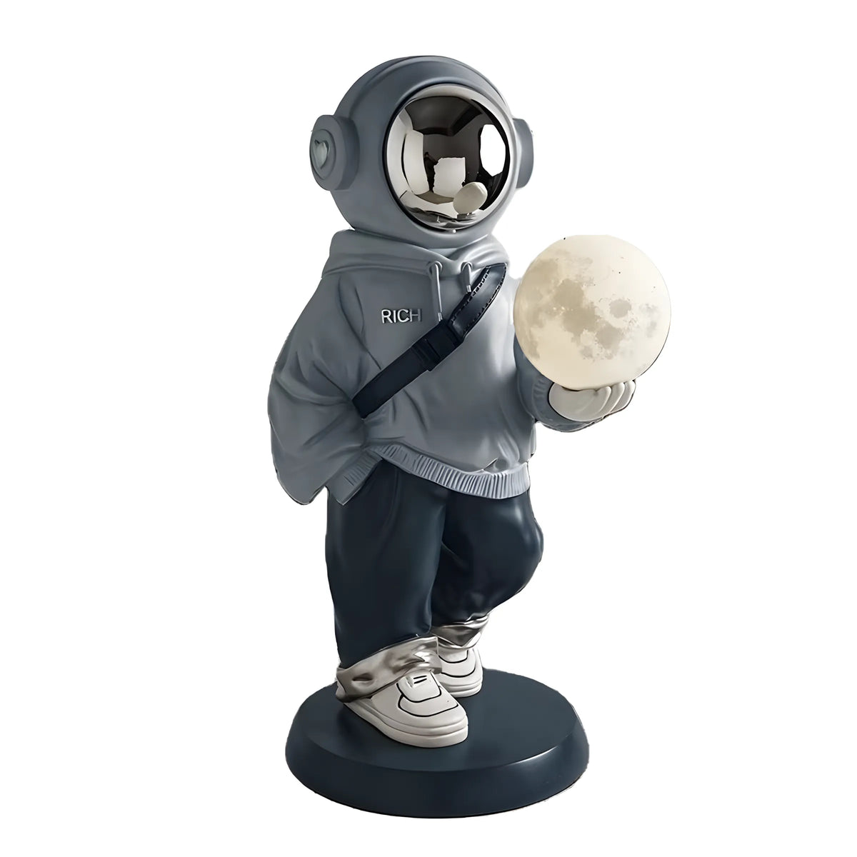 A collectible astronaut figurine wearing a gray space suit and holding a moon globe, standing on a round dark base against a white background.