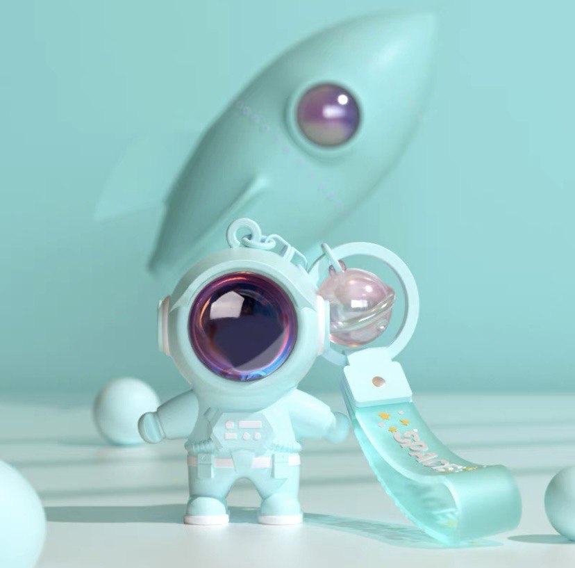 Astronaut keychain with flashlight green