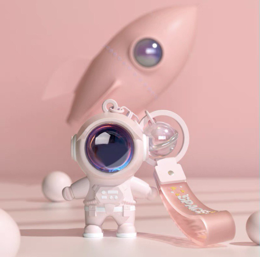 Astronaut keychain with flashlight pink