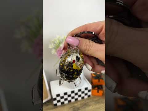 Keychain astronaut in a rocket on skateboard