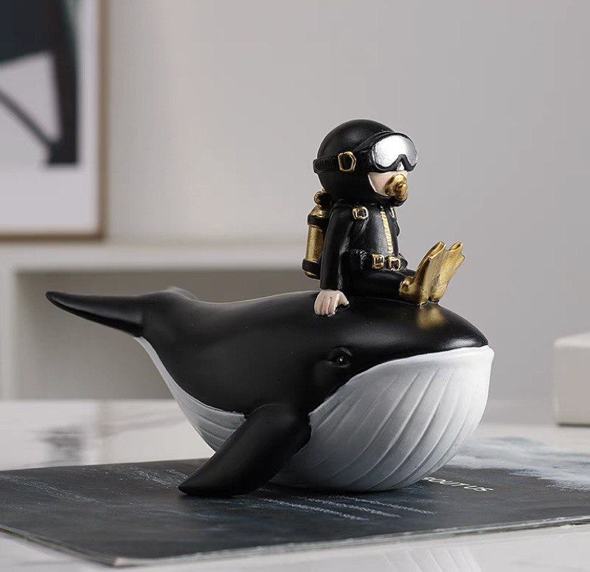 Statuette of a diver on a whale