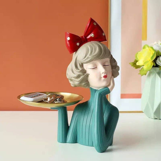 Decorative figurine girl with a tray