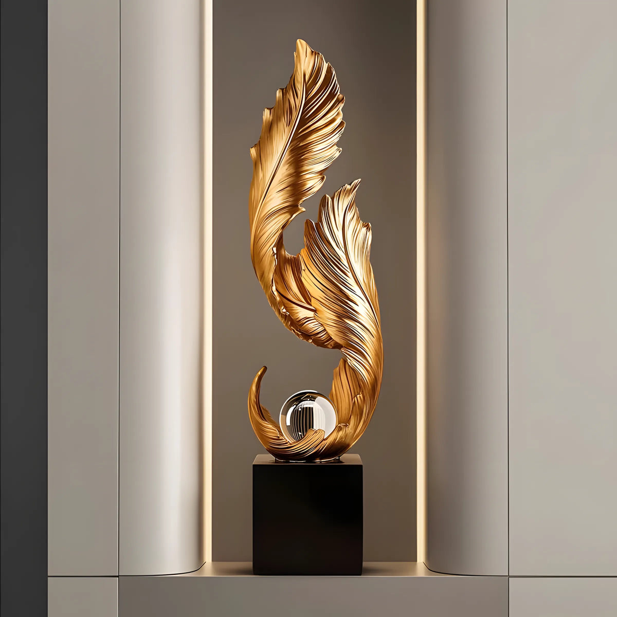 Decorative gold sculpture on a black base against a neutral wall.