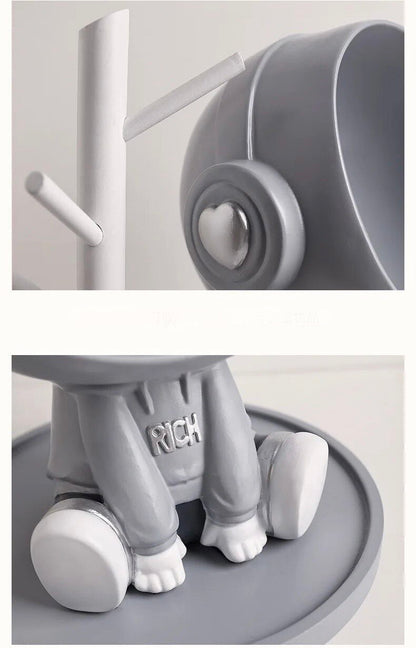 Astronaut figurine with a stand for small items, gray