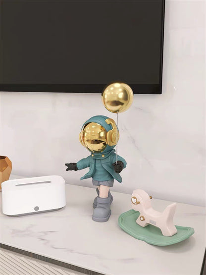 Blue astronaut figurine with ball