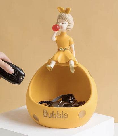 Figurine, phone stand girl with gum orange