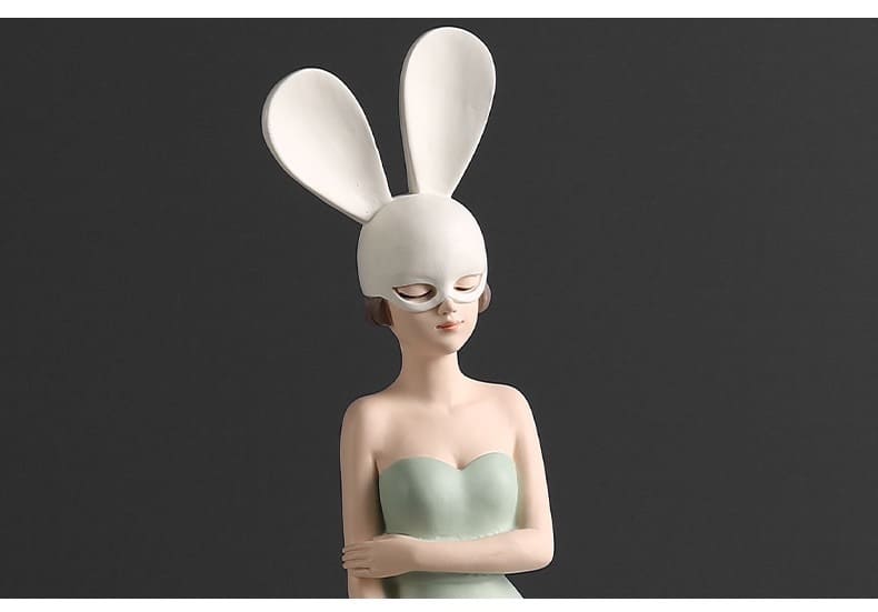 Figurine of a girl with rabbit ears