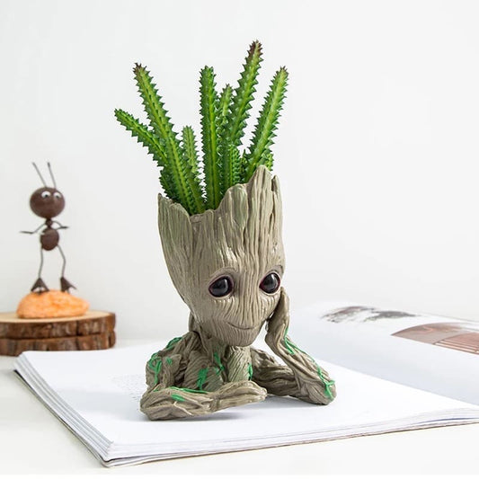 Vase, plant pot, plant with hand under chin