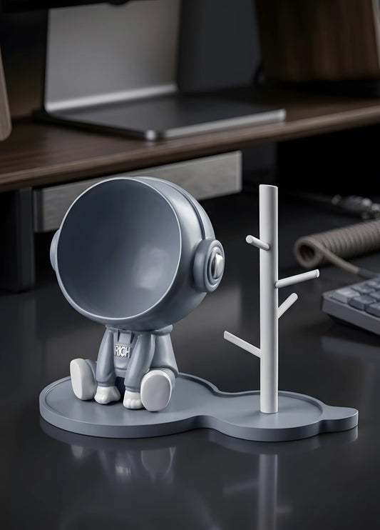 Astronaut figurine with a stand for small items, blue