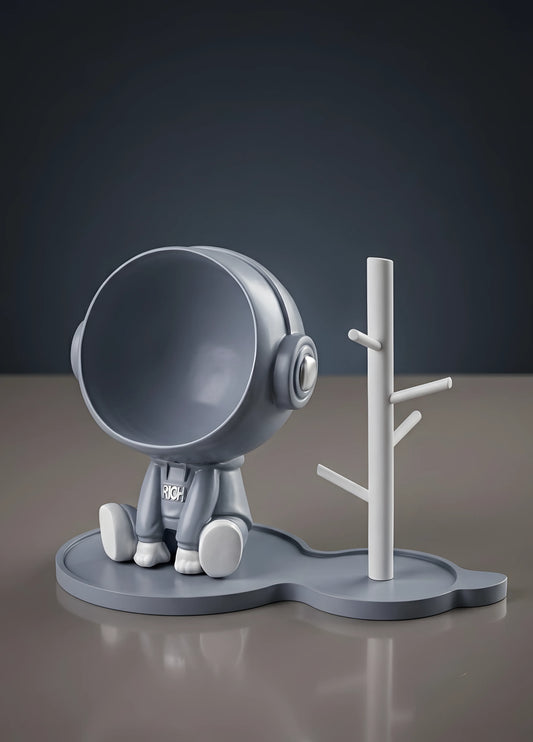 Astronaut figurine with a stand for small items, blue