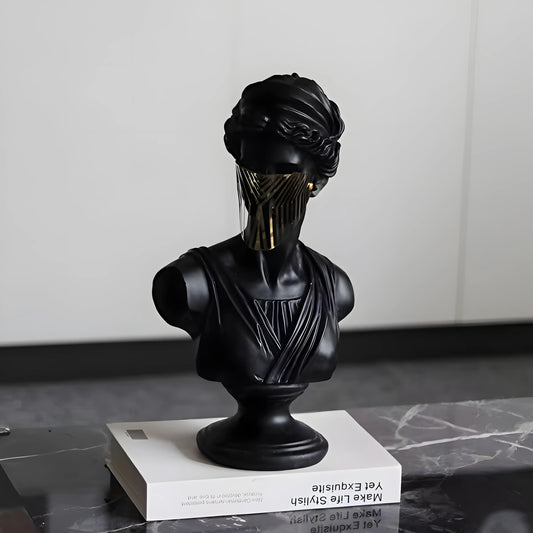 Black bust sculpture on a white platform with a neutral background