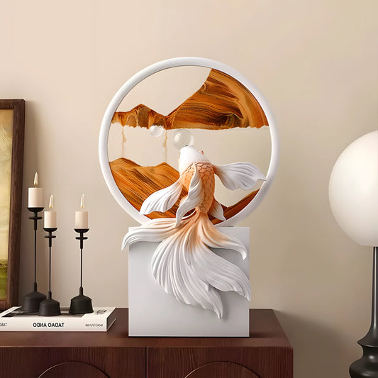 A decorative sculpture of a white and orange koi fish swimming in front of a circular wooden screen, mounted on a white rectangular pedestal on a wooden console table.