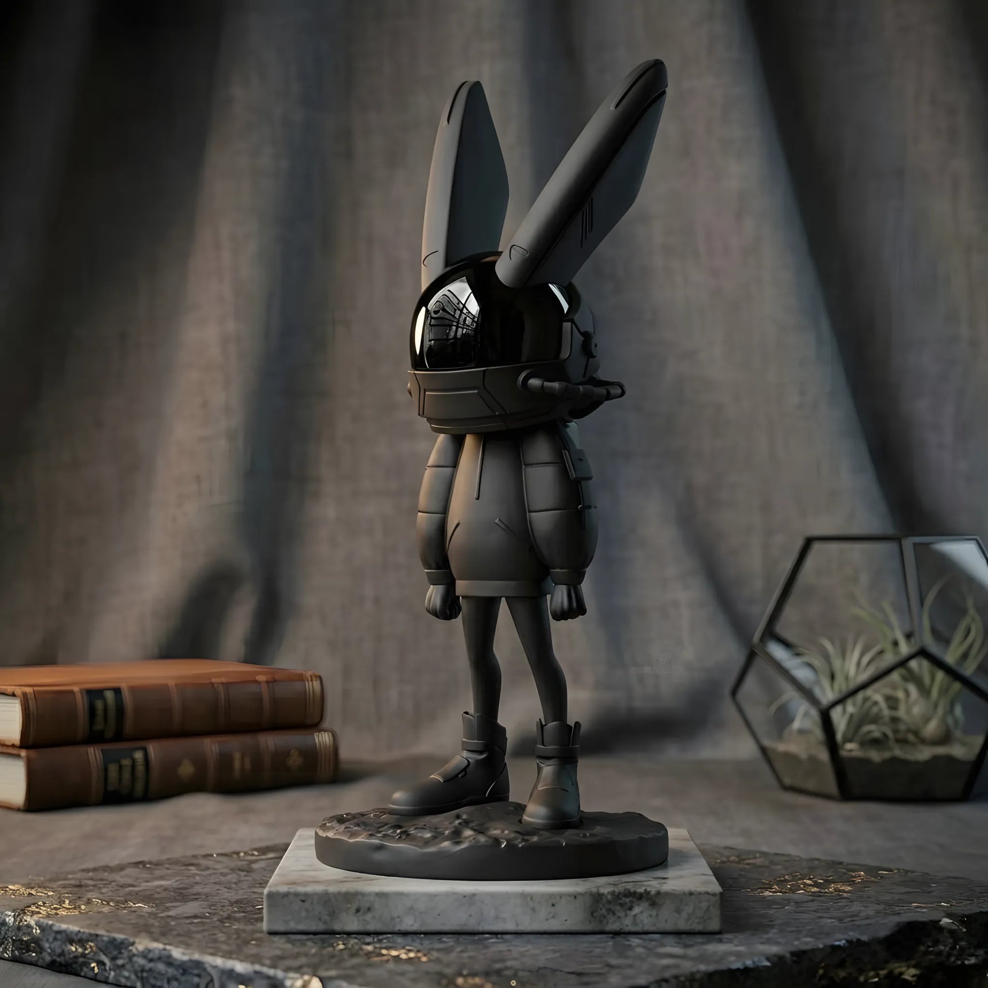 Side profile of the 34cm matte black astronaut rabbit statue standing on a marble base next to vintage books and a geometric glass terrarium
