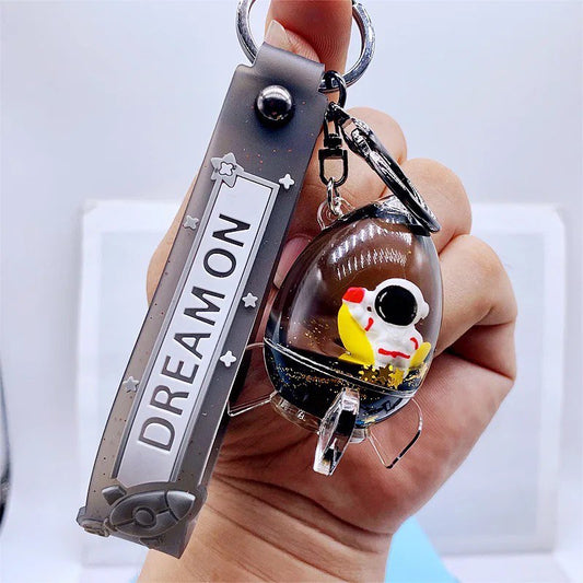 Keychain astronaut in a rocket on moon